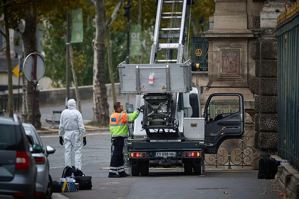 Police examine a furniture elevator used in a robbery at the Louvre Museum on Oct. 19, 2025, in Paris, France. Kiran Ridley—Getty Images